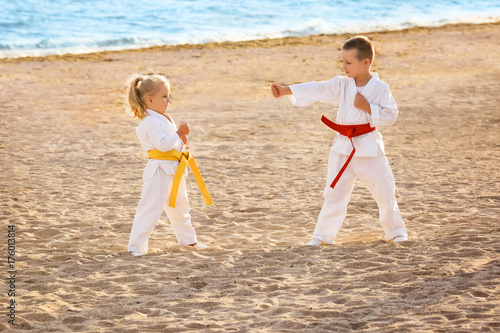 Little children practicing karate outdoors