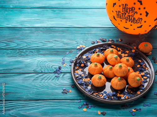Pumpkin shape halloween marshmallow with orange balloon. Trick or treat
