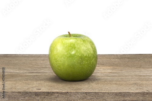 green apple on a wooden background