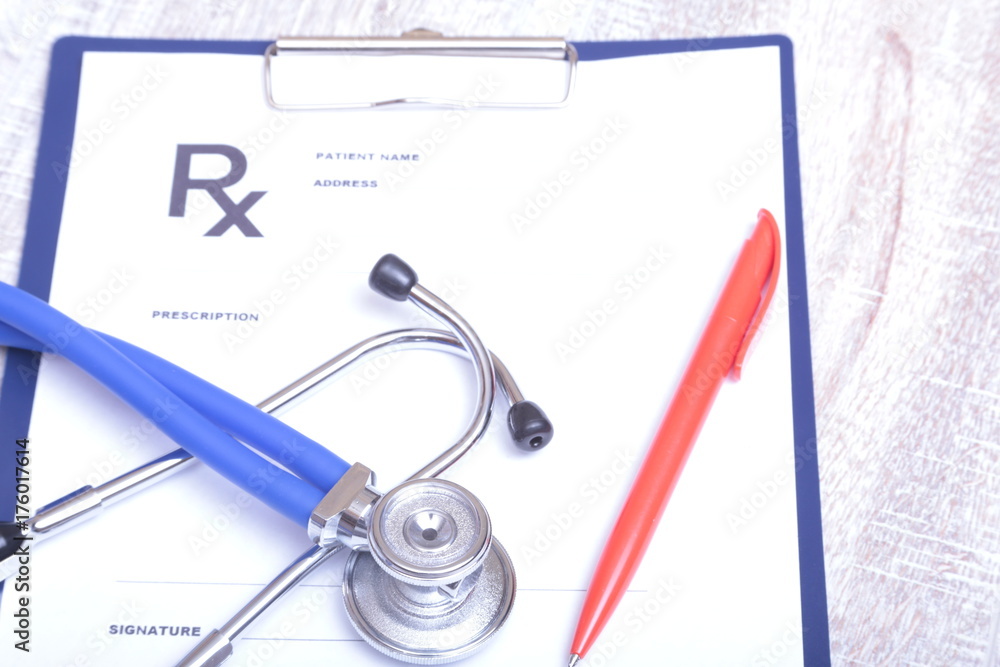 Closeup of medical stethoscope on a rx prescription Closeup of medical stethoscope on a rx prescription