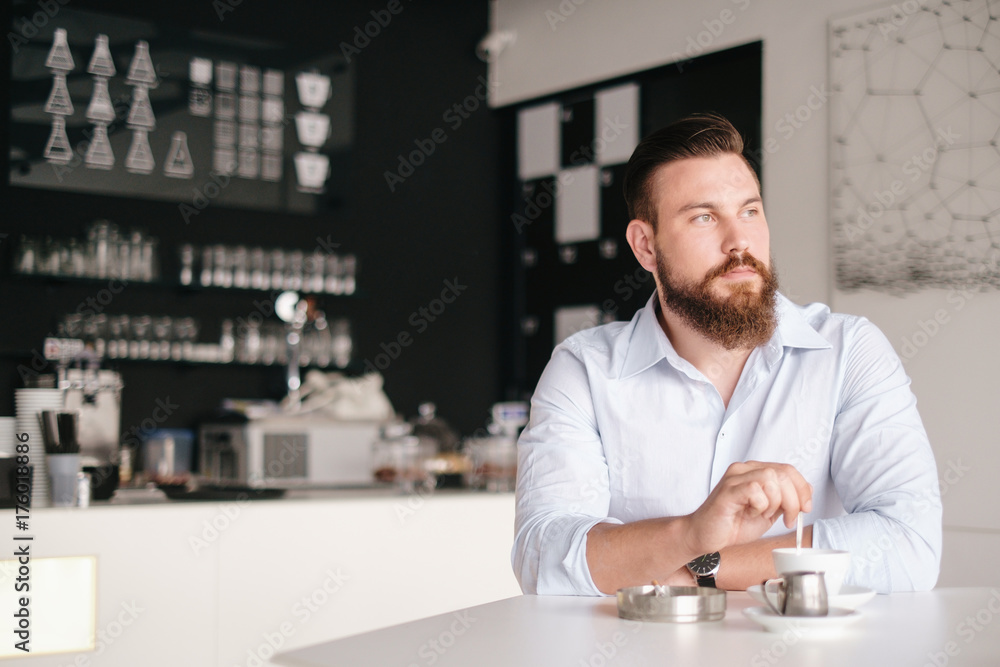 Handsome Bearded Man Sitting at the Cafe Handsome Bearded Man Sitting at the Cafe