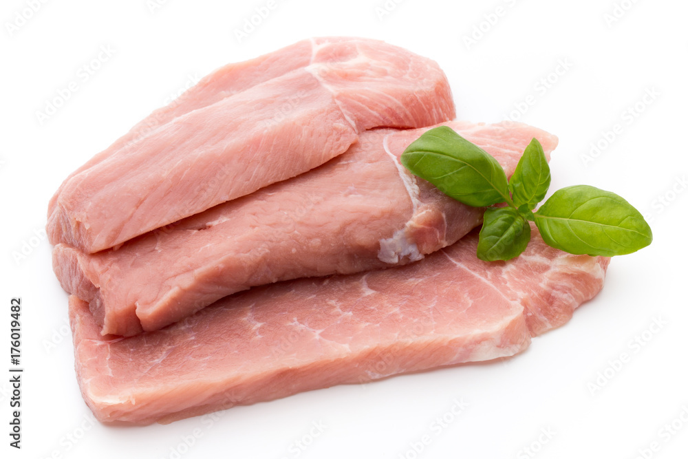Fresh pork fillet with basil on a white background. Fresh pork fillet with basil on a white background.