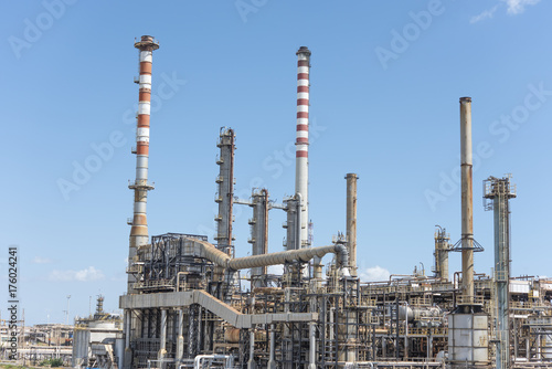 Oil and gas refinery, pipelines and towers, heavy industry photo