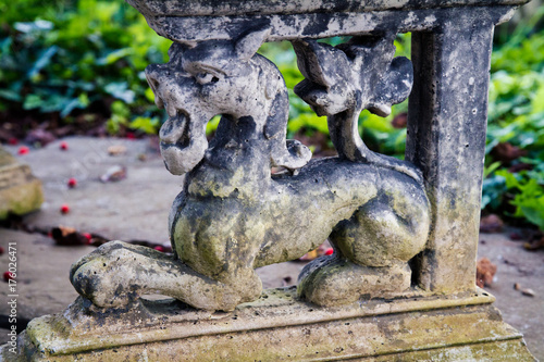 Stone decoration of a lion on a garden patio