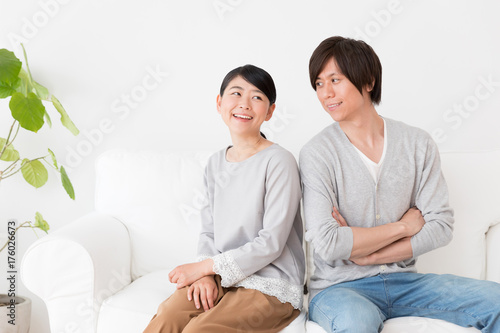 young asian couple in living room