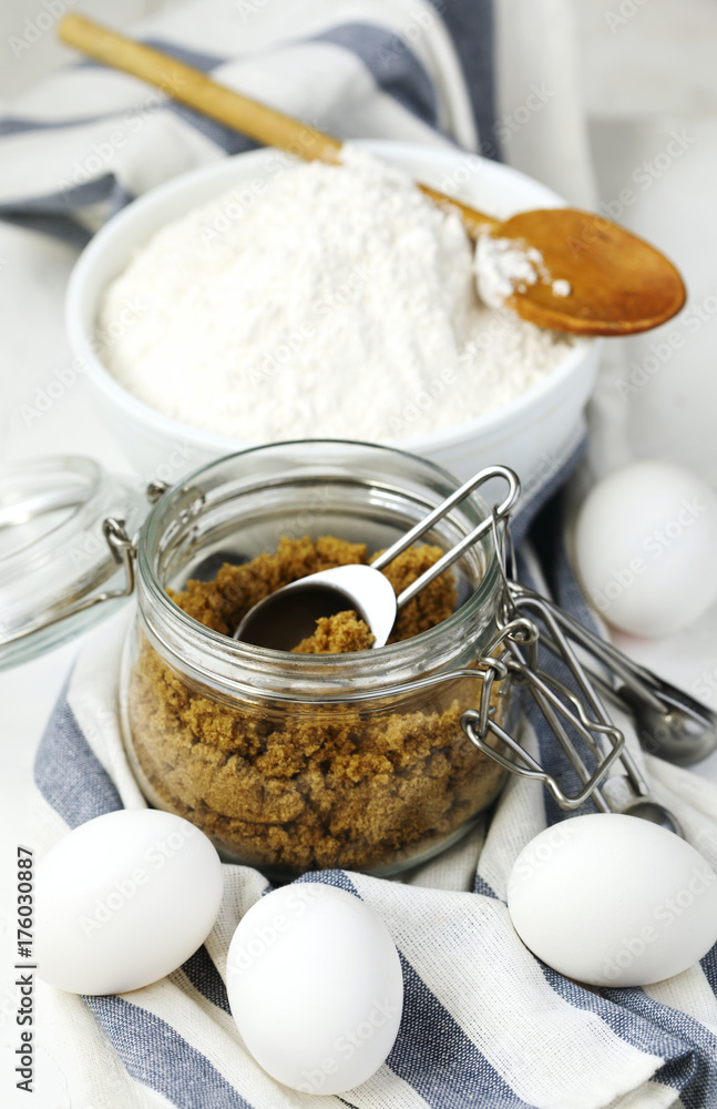 Flour, brown sugar and eggs for baking Flour, brown sugar and eggs for baking