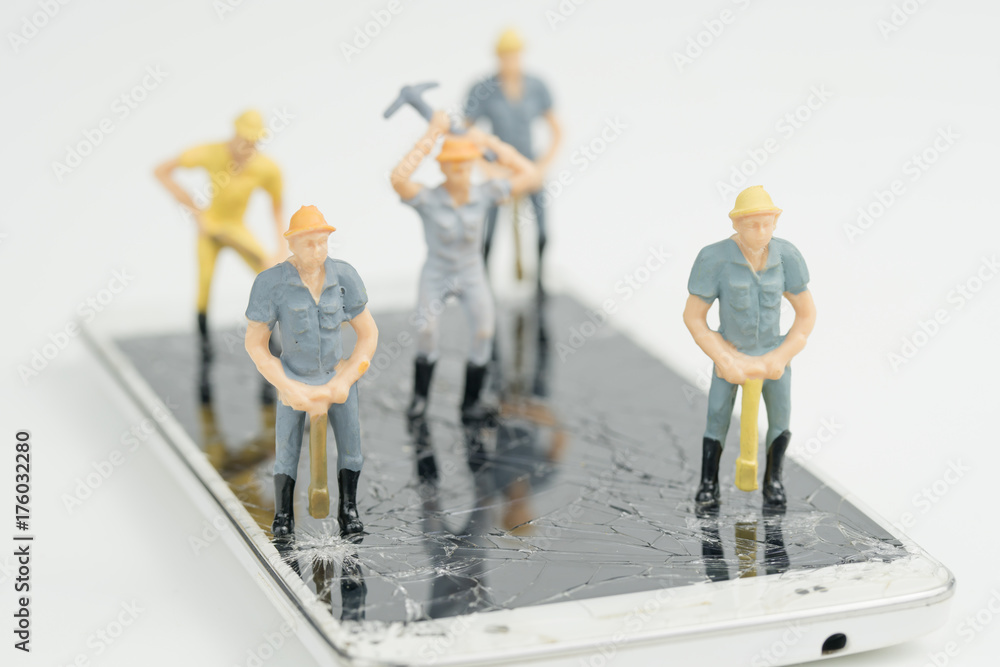 Electronic board with miniature figure worker man at repair and work Electronic board with miniature figure worker man at repair and work