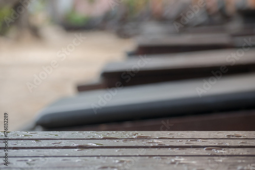 chair on beach of relaxing lake at sunset