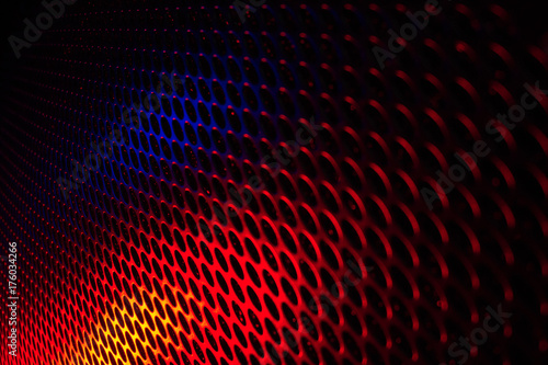 Black grid speaker texture with red and blue colors