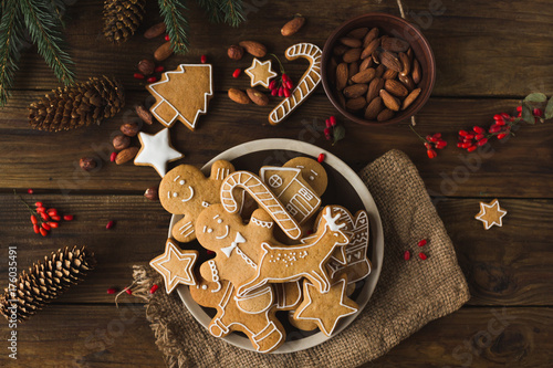 Ginger men on a wooden background. Gingerbread. Christmas cookies