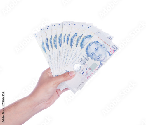 hand with Singapore banknotes dollars (50 SGD) isolated on white background photo