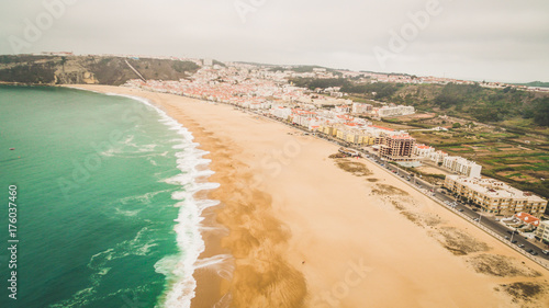 Beautiful empty ocean sandy beach in Nazar , Portugal. Aerial view
