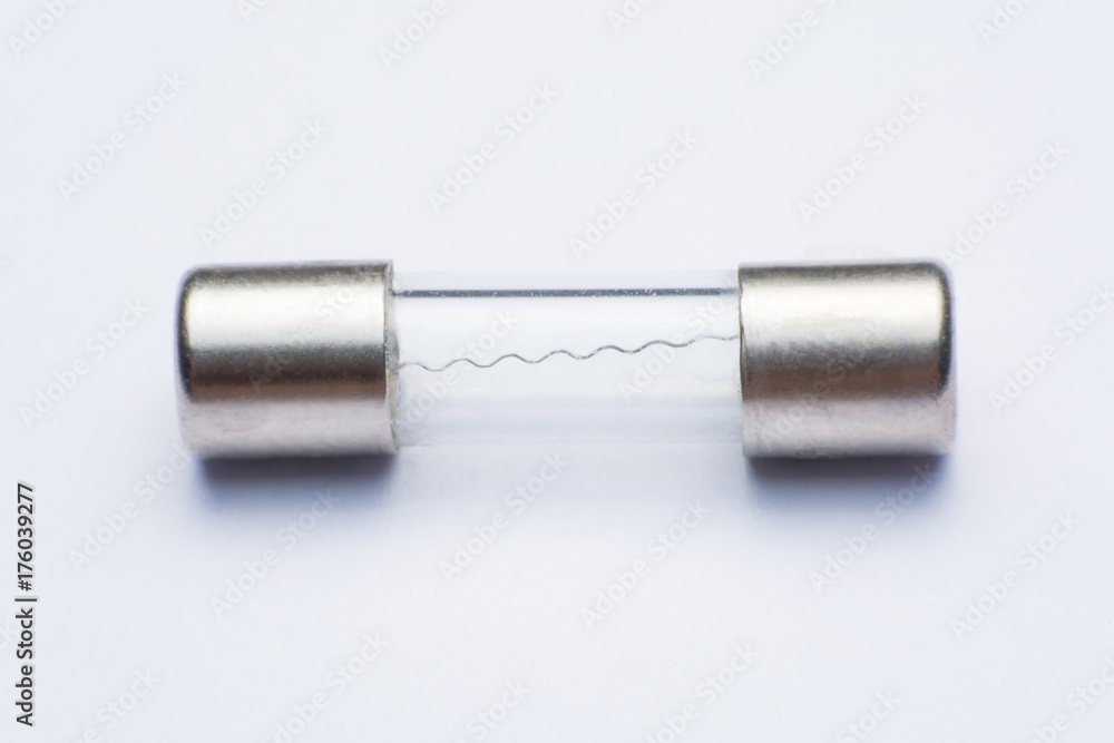 Electrical fuse in glass capsule shape, isolated on white background. Electrical fuse in glass capsule shape, isolated on white background.