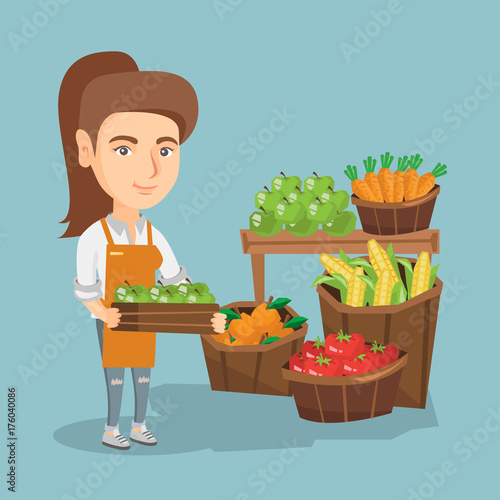 Caucasian greengrocer holding box with apples. Greengrocer standing in front of grocery stall with vegetables and fruit. Woman selling vegetables and fruit. Vector cartoon illustration. Square layout.