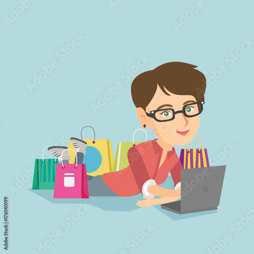 Young caucasian woman using a laptop for online shopping. Smiling woman lying with a laptop and shopping bags around her. Woman doing online shopping. Vector cartoon illustration. Square layout.