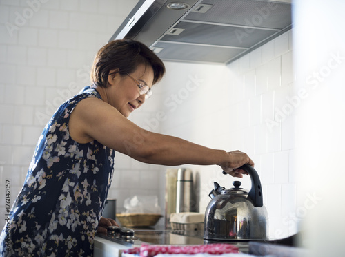 Senior Woman Cooking Food Kitchen