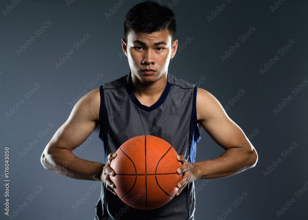 Portrait of a healthy basketball player with a  ball.