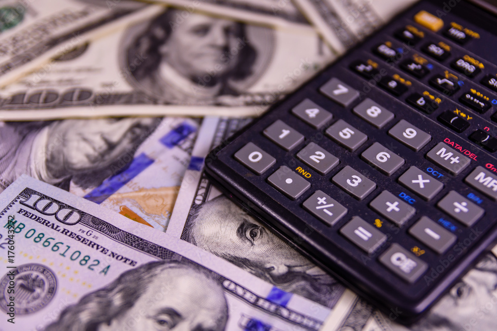 Modern calculator on a one hundred dollar bills Modern calculator on a one hundred dollar bills