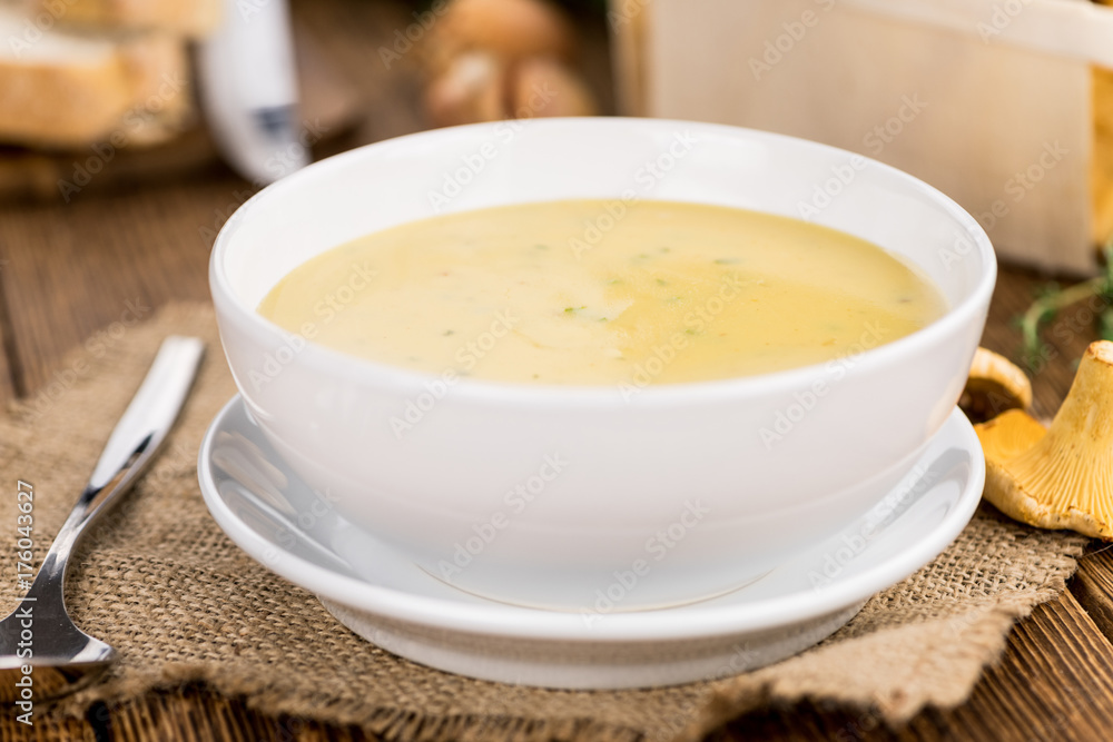 Fresh made Creamy Chanterelle Soup on a rustic background Fresh made Creamy Chanterelle Soup on a rustic background