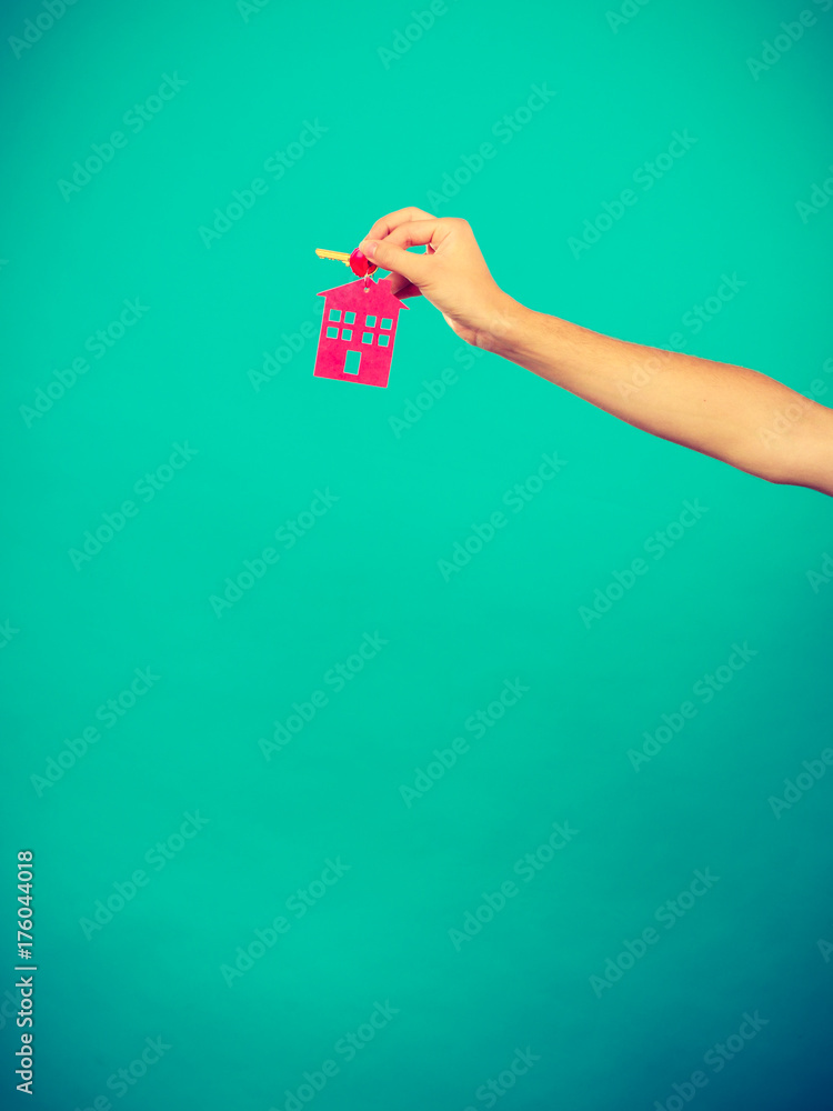 Person holding keys with pendant in house shape Stock Photo | Adobe Stock