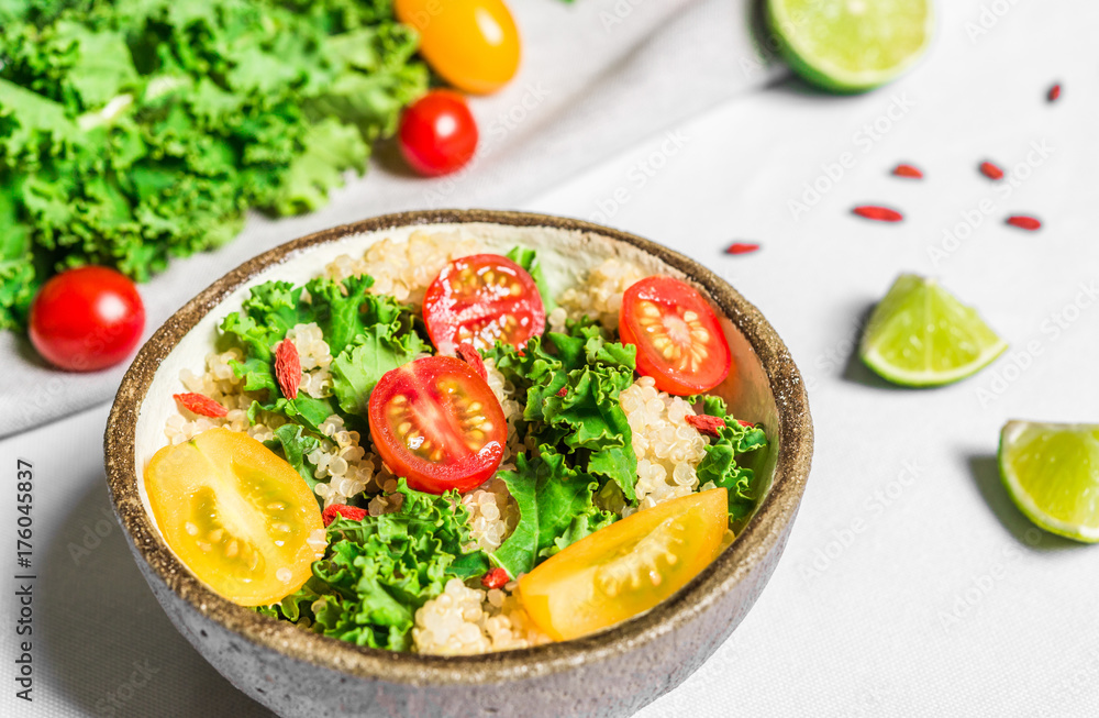 Colorful photo of a quinoa, goji berry, and kale vegetable salad in a bowl against white background. Healthy food, eating, fitness, diet, vegan, vegetarian, and superfood concept. Colorful photo of a quinoa, goji berry, and kale vegetable salad in a bowl against white background. Healthy food, eating, fitness, diet, vegan, vegetarian, and superfood concept.