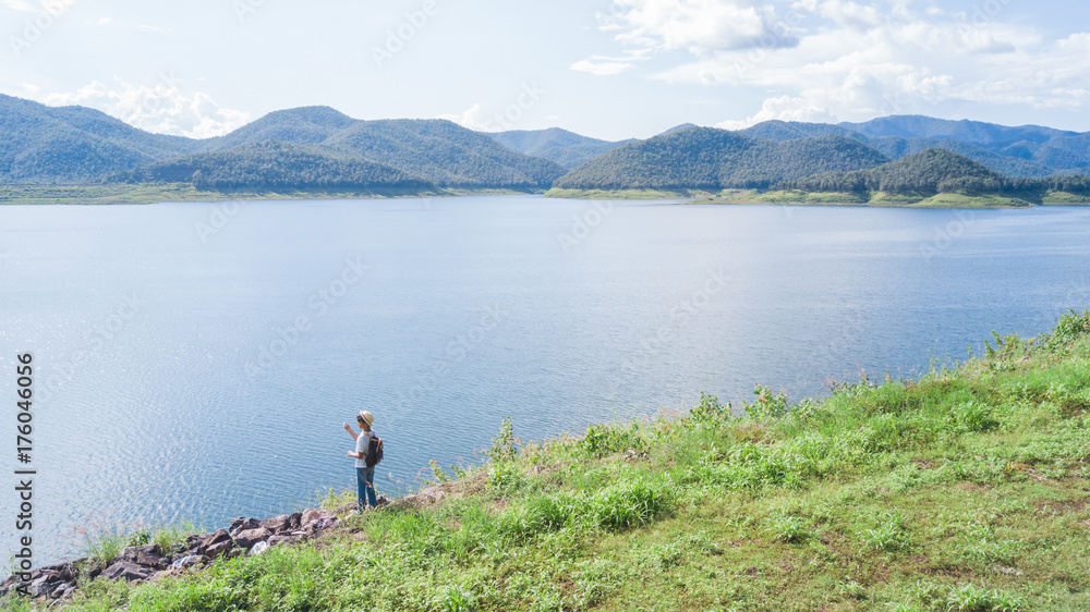 young asian boy traveling alone at nature park, vintage tone