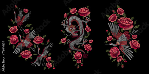 Set. a crane, a fire bird, a dragon and red roses. Traditional folk stylish stylish embroidery on the black background. Sketch for printing on clothing, fabric, bag, accessories and design. 
