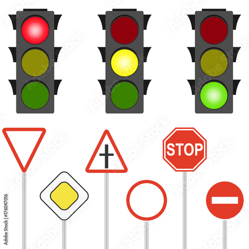 Road signs and traffic lights. A flashing traffic light.