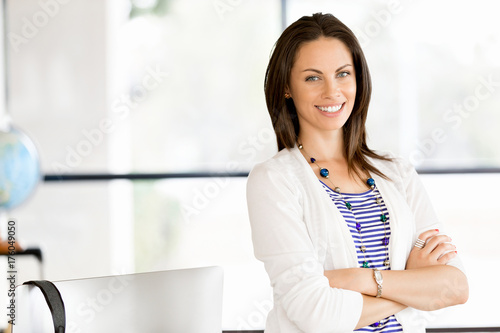 Happy entrepreneur or freelancer in an office or home Free Download Happy entrepreneur or freelancer in an office or home - GFXLoad