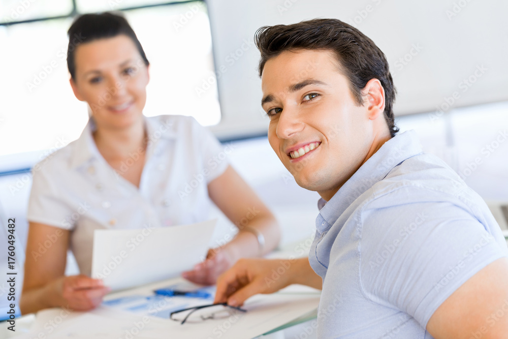 Young man in casual in office Young man in casual in office
