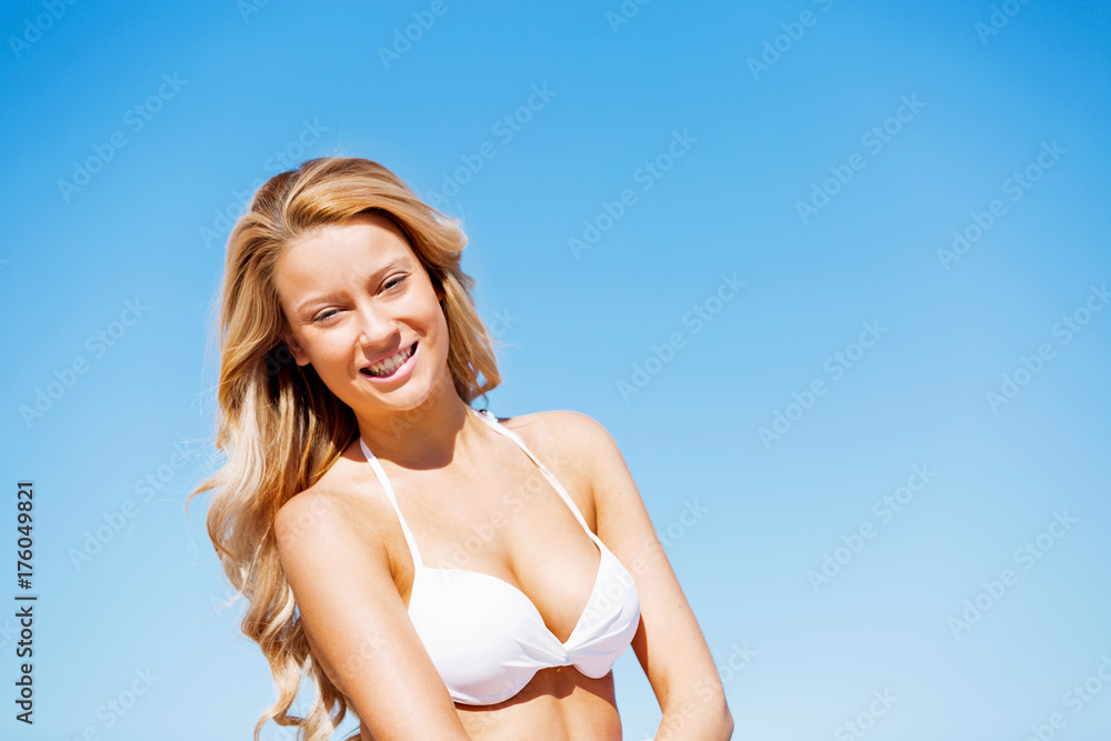 Fototapeta premium Young woman relaxing on the beach