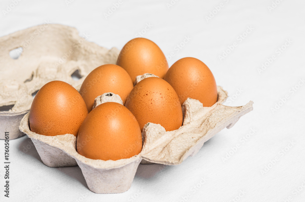 Fresh chicken eggs against white background Fresh chicken eggs against white background