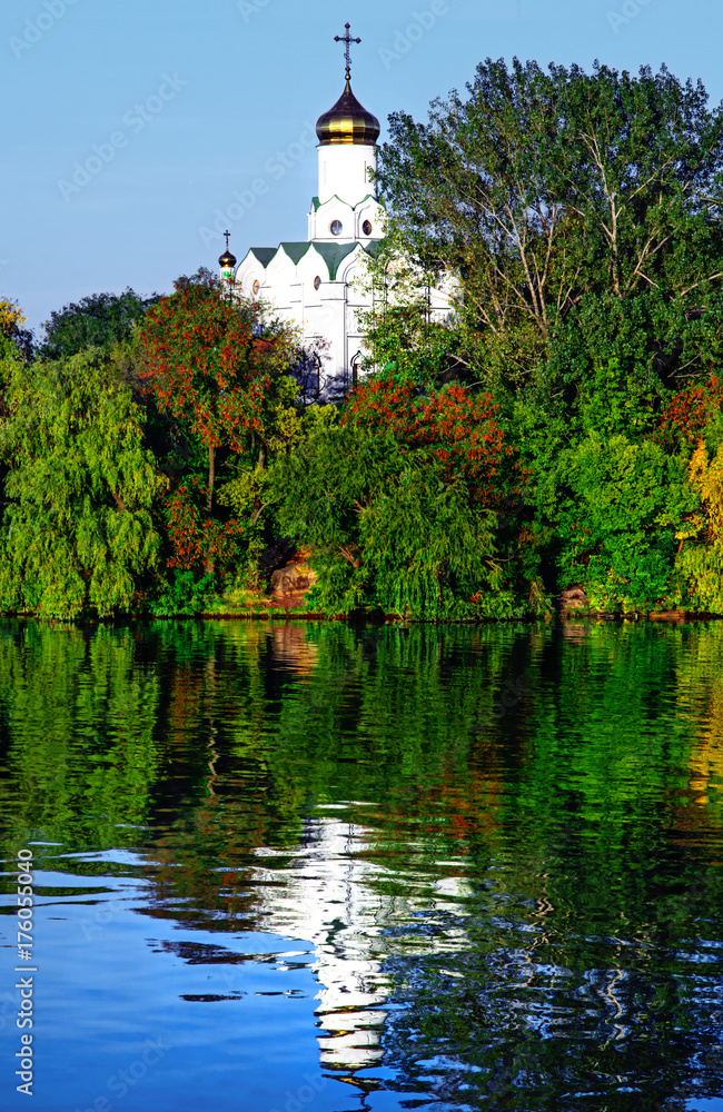The Christian Church on Monastyrsky Island in the city of Dnepr on the river.. Dnepropetrovsk, Dnipropetrovsk, Dnipro city, Ukraine. Sunny Autumn day. The Christian Church on Monastyrsky Island in the city of Dnepr on the river.. Dnepropetrovsk, Dnipropetrovsk, Dnipro city, Ukraine. Sunny Autumn day.
