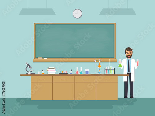 Science teacher teaching student in classroom.