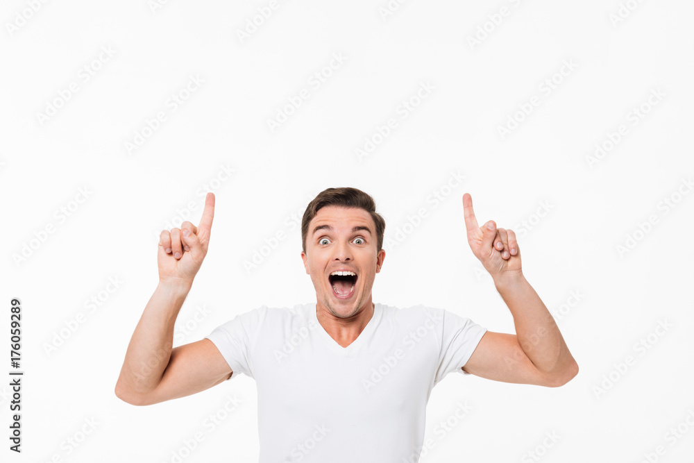 Portrait of an amused excited man in a white t-shirt Portrait of an amused excited man in a white t-shirt