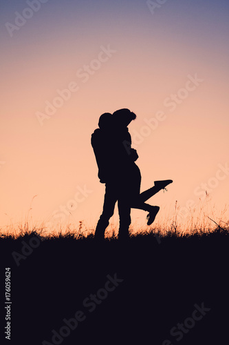 Silhouette Of People having fun at sunset time