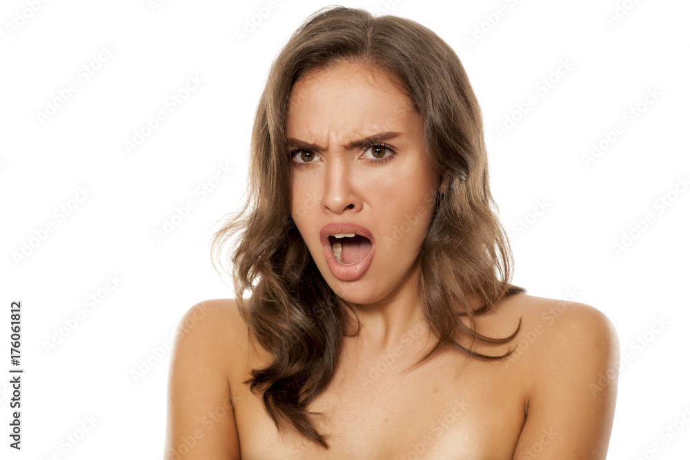 Portrait of beautiful young shocked woman on white background Portrait of beautiful young shocked woman on white background