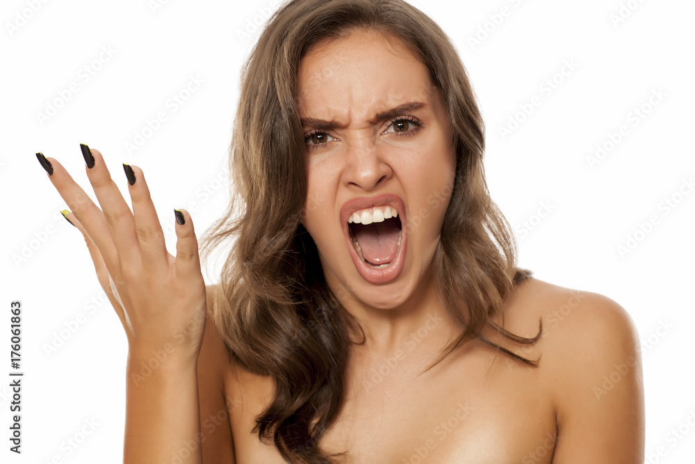 Portrait of beautiful young angry woman on white background Portrait of beautiful young angry woman on white background