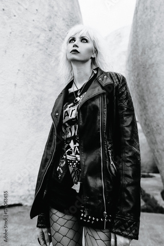 monochrome portrait of stylish blonde grunge young woman 