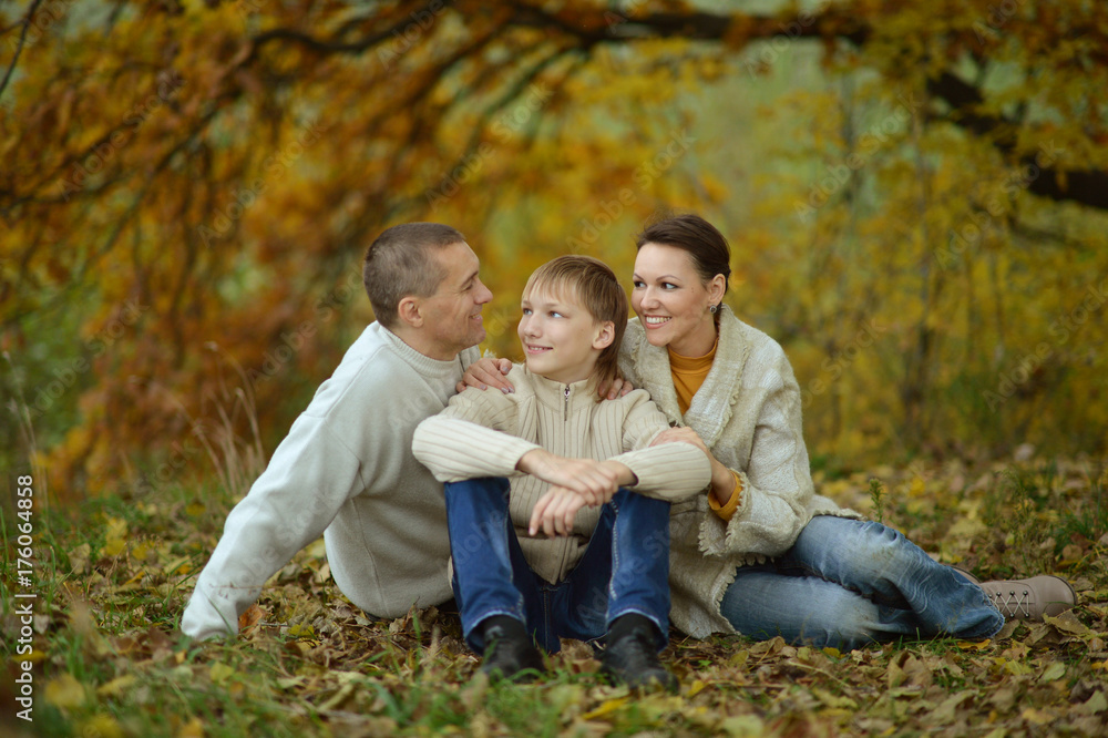 Happy family in the autumn park Happy family in the autumn park