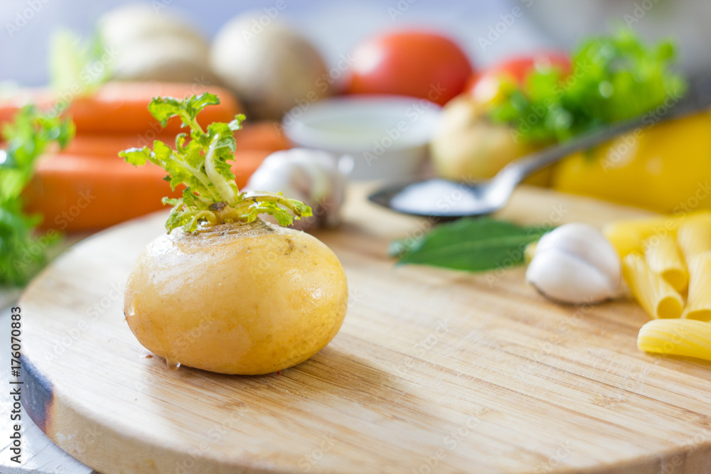 Kitchen board with fresh ripe yellow turnip. Kitchen board with fresh ripe yellow turnip.