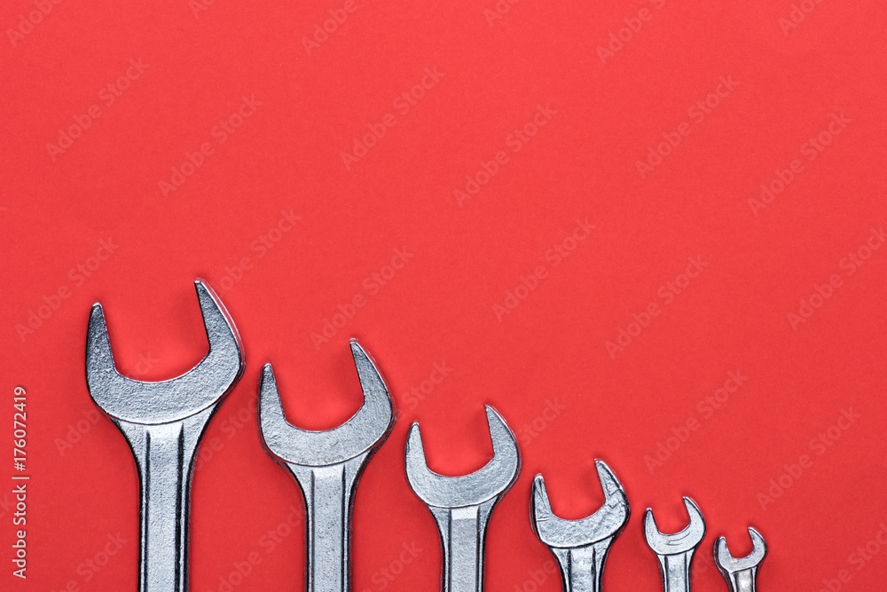 Line of different-sized wrenches Line of different-sized wrenches