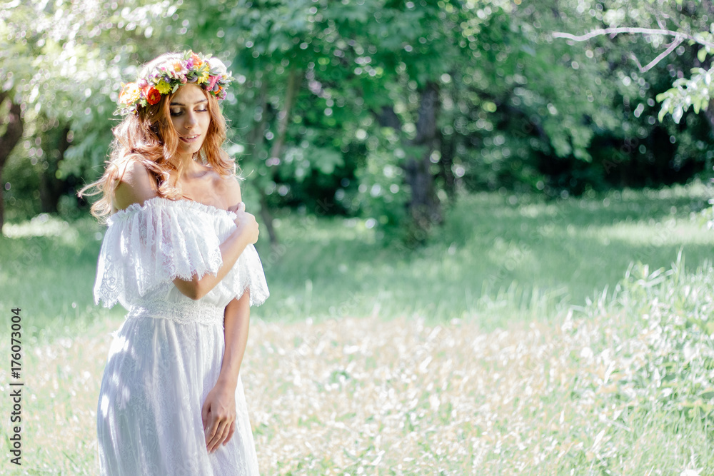 Wedding background. Bride in wedding dress with flower wreath on hairs.
