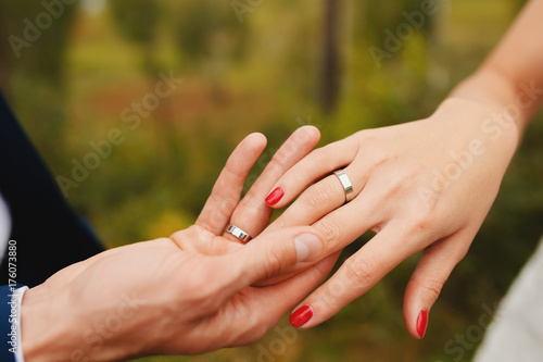 Marry me. Bride and groom s hands with wedding rings