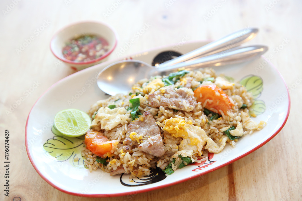 Pork fried rice with lime on wood background , Thai food