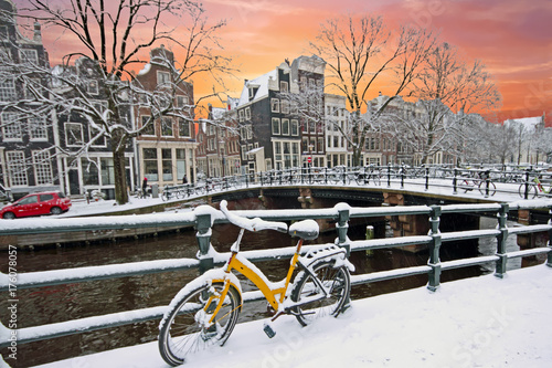 Photography Sunset in snowy Amsterdam in the Netherlands at the Amstel in winter