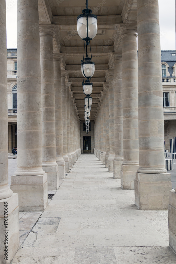 Famous palace in Paris, France - Palais Royal. Gallery, colonnade - architectural details.