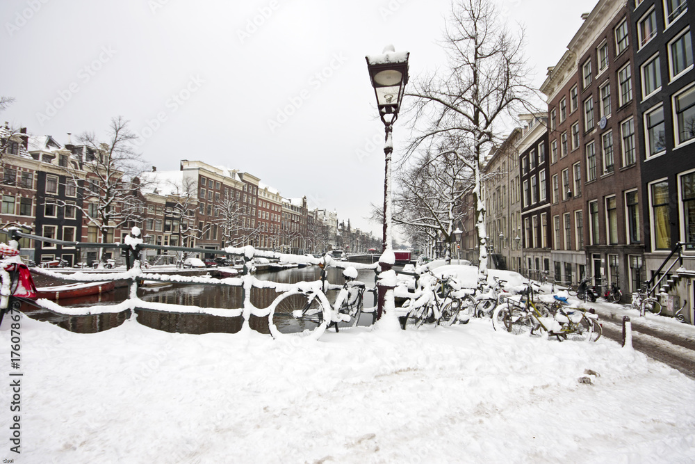 Fototapeta premium Snowy Amsterdam in the Netherlands