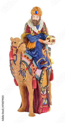 Christmas nativity King figure riding camel isolated on a white background