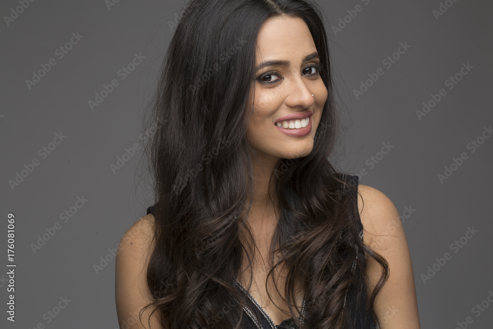 Portrait of pretty Indian woman smiling with long black hair Stock-Foto |  Adobe Stock